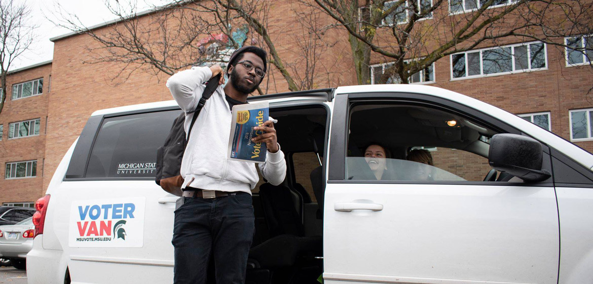 MSU vote Voter Van dropping off a student to vote 