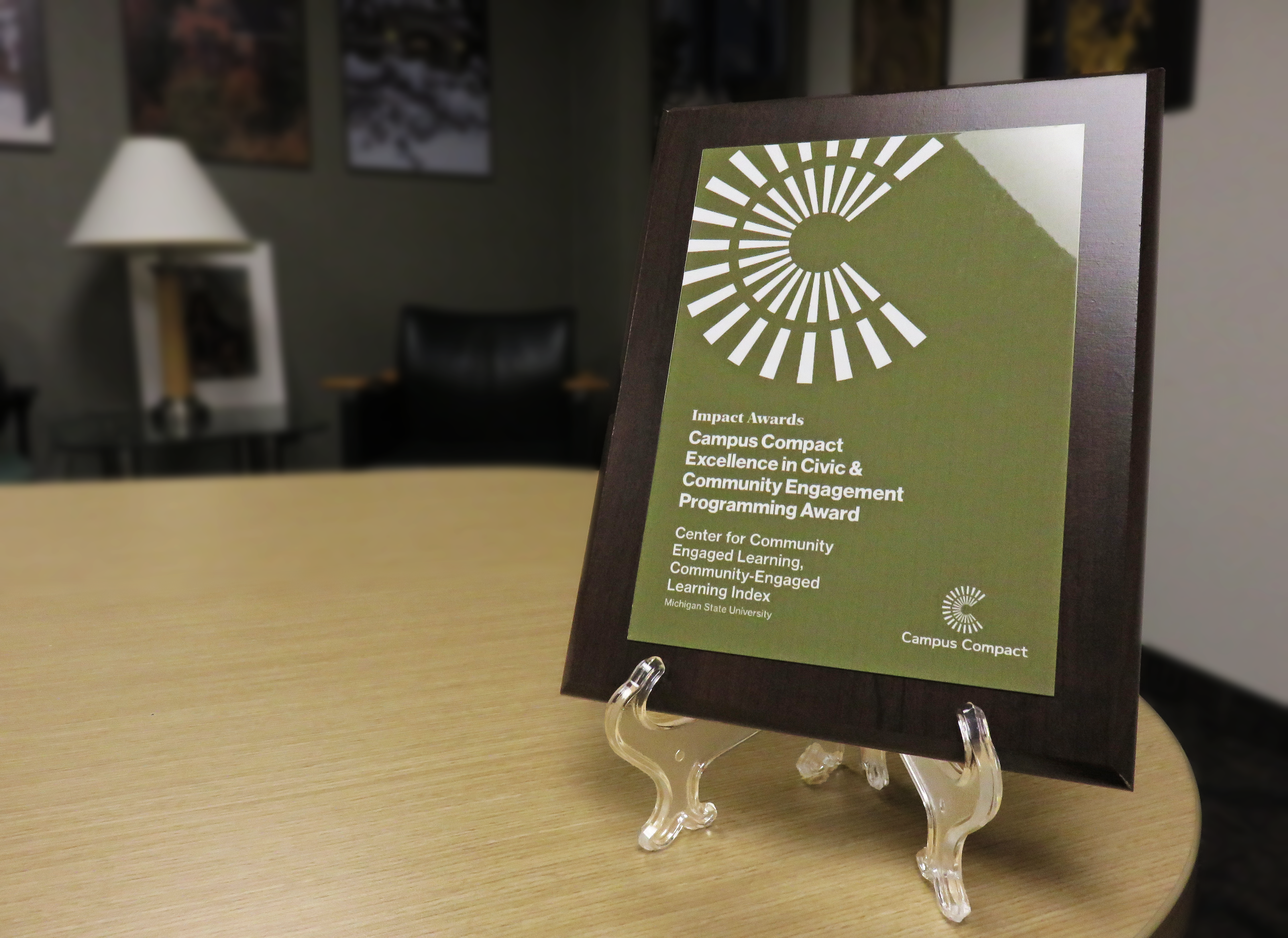 A photo of the Excellence in Civic and Community Engagement Programming Award presented to Michigan State University for the Community-Engaged Learning Index