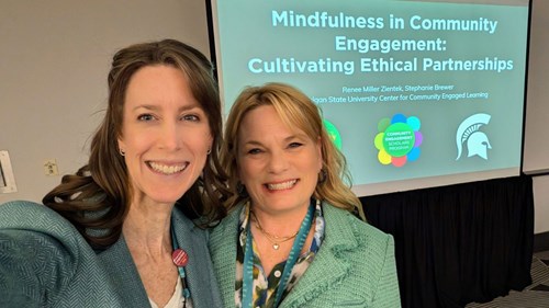 A selfie of CCEL assistant director Stephanie Brewer and executive director Renee Miller Zientek before their Compact26 presentation on 'Mindfulness in Community Engagement: Cultivating Ethical Partnerships'