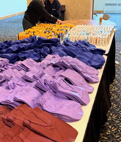 Bags and hygiene supplies are laid out tables for Greek Week participants to pack kits for Haven House and the Women’s Center of Greater Lansing.