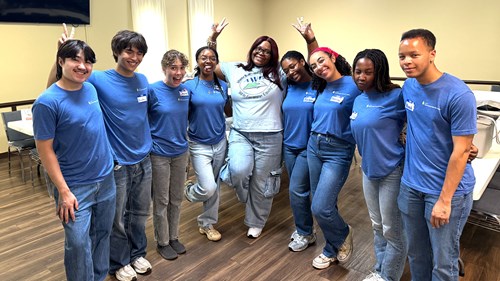 Ph.D. and community engagement certification student Angelique Willis (center) poses with student interns from the Community-Soil-Air-Water program at Georgia State University’s Department of Geosciences. Willis worked with this team of interns to coordinate logistics for a symposium hosted by the Atlanta Watershed Learning Network Alumni Group.