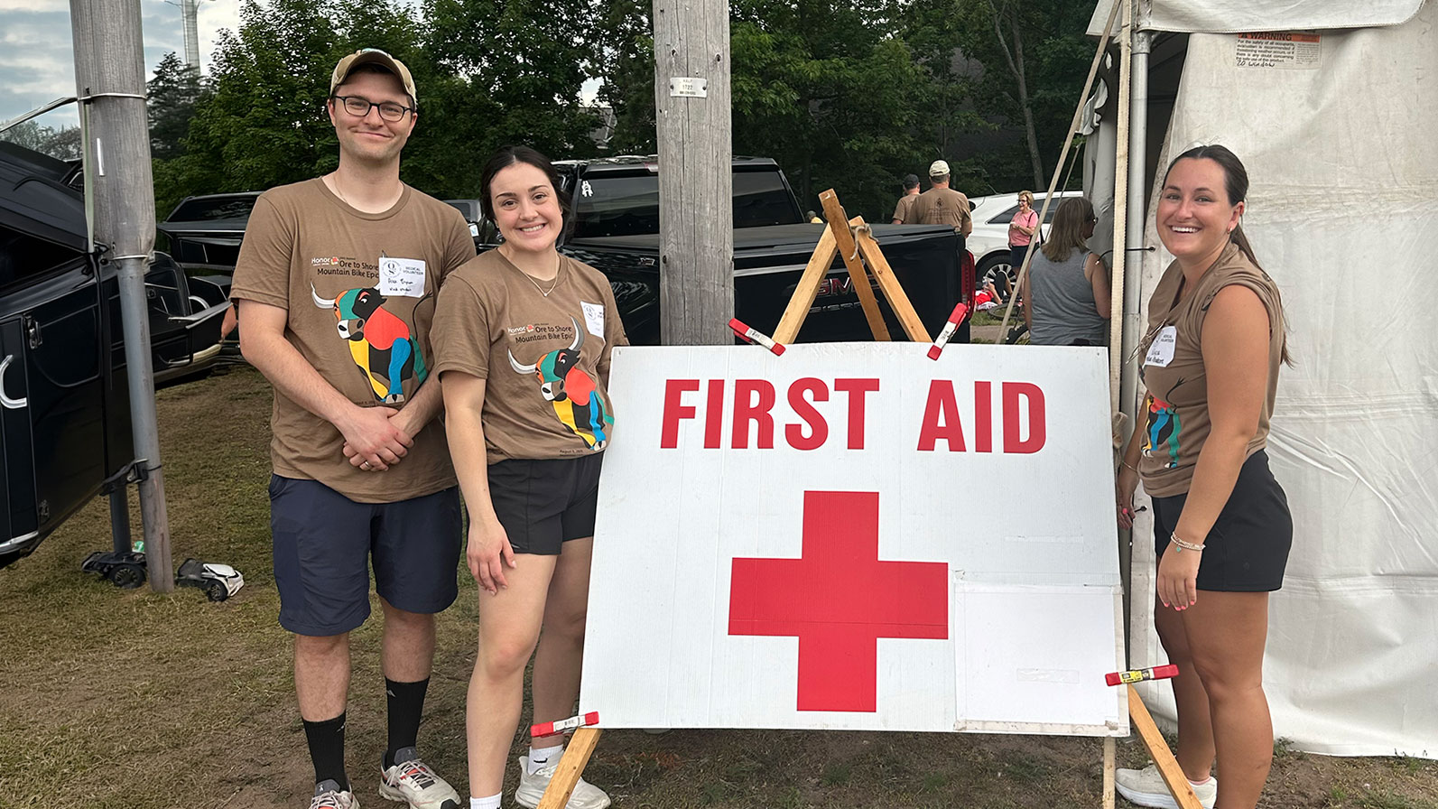Students in both the Lower Peninsula rural community health program and Upper Peninsula rural physician program volunteer at local events as part of their medical training. These volunteers offer first aid at the Ore to Shore Mountain Bike Epic in Marquette, Michigan.