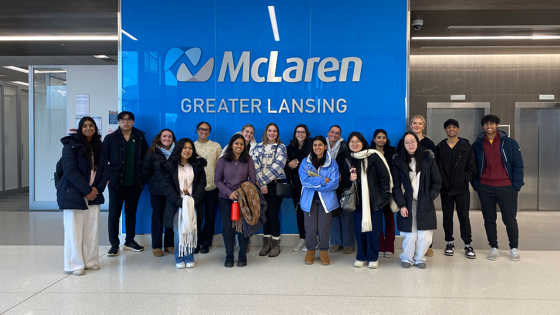 A group picture of a 2025 cohort of volunteers on site at McLaren Greater Lansing