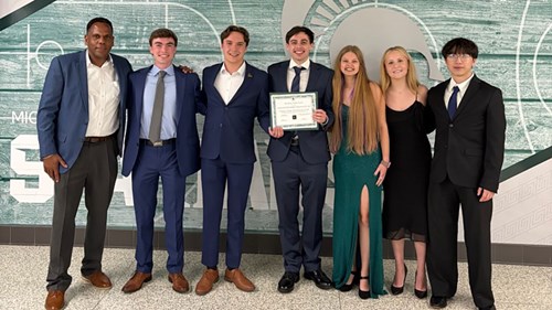 A group photo of MSU VITA executive board members after accepting the inaugural Professional Development Program of the Year award from the Broad Student Senate. L to R: MSU VITA co-advisor Wayne Nesbitt, social media director Brayden Shimon, vice president Caiden Kippnick, president Erich Schroeder, treasurer Kaitlyn Dimock, client relations chair Katherine Ristich, and recruiter Calvin Zheng.