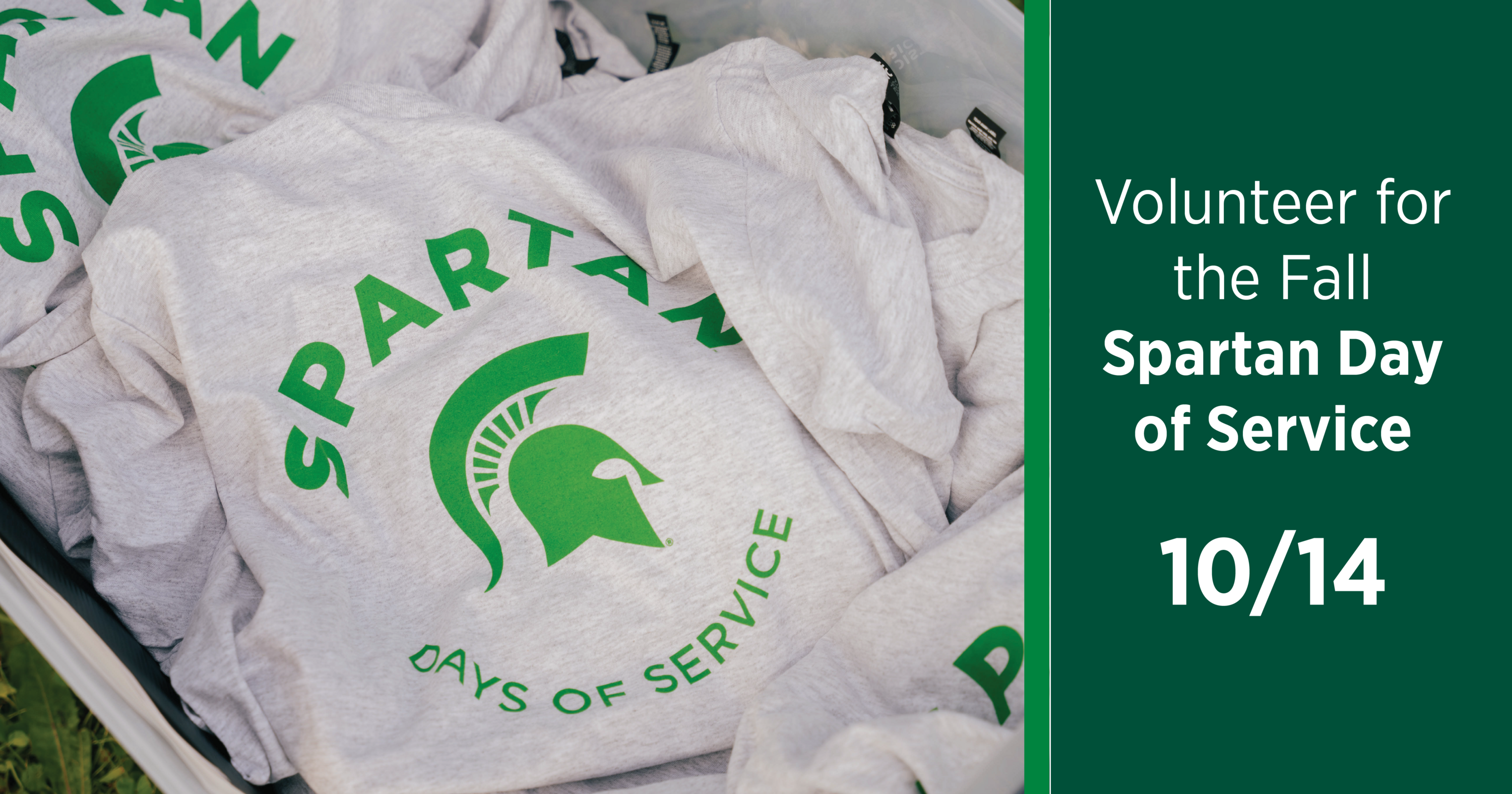A pile of white t-shirts with the words Spartan Days of Service on them, next to a dark green box reading Volunteer for the Fall Spartan Day of Service 10/14
